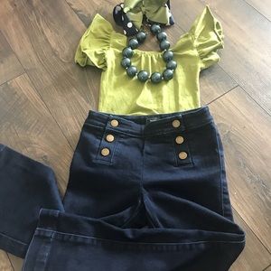 Girls green ruffle sleeve body suit.